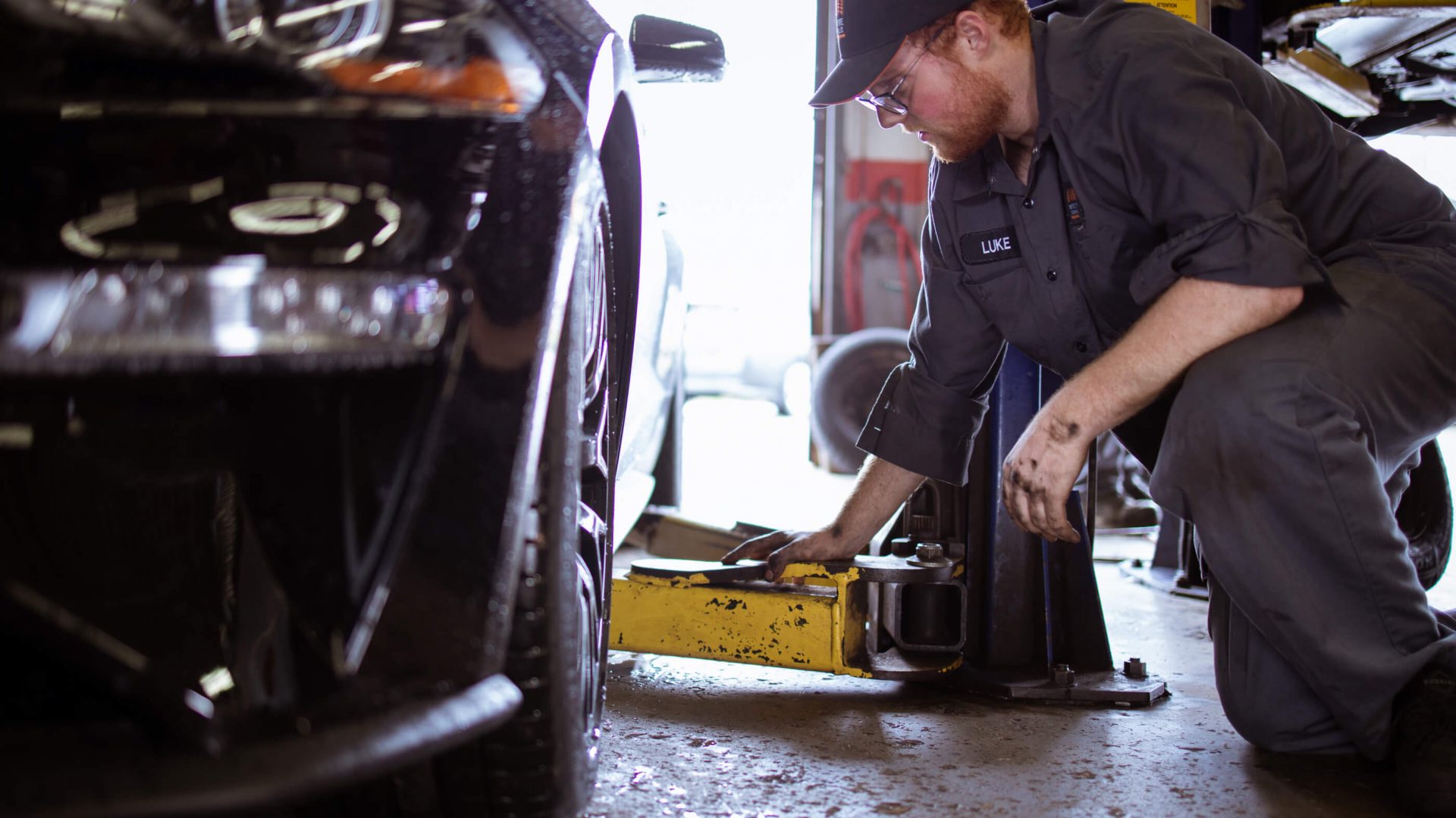 MTC Tire Oakville mechanic inspecting brake and wheel components
